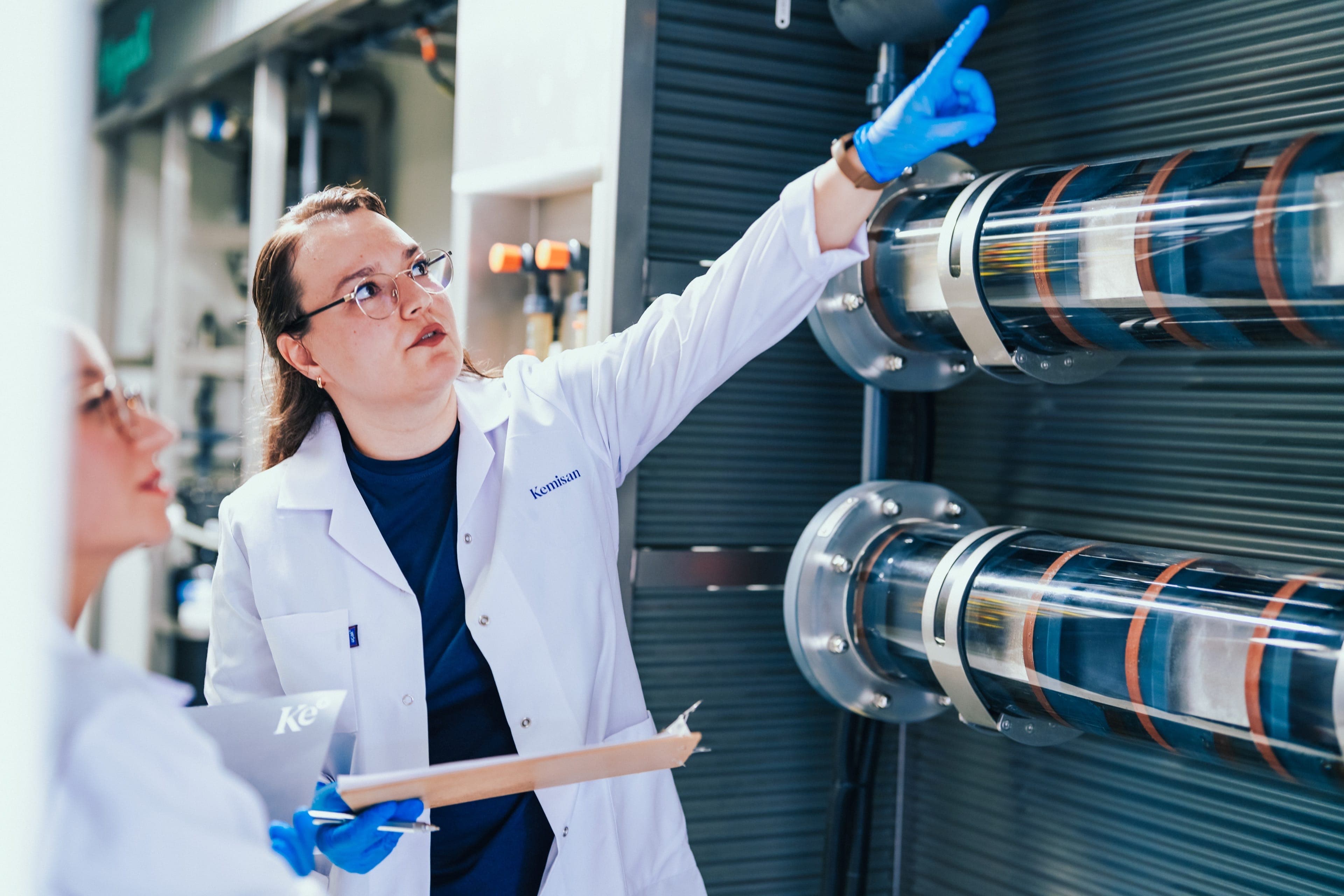 Kemisan engineer reviewing in-house electrolyzer components for the CX containerized system