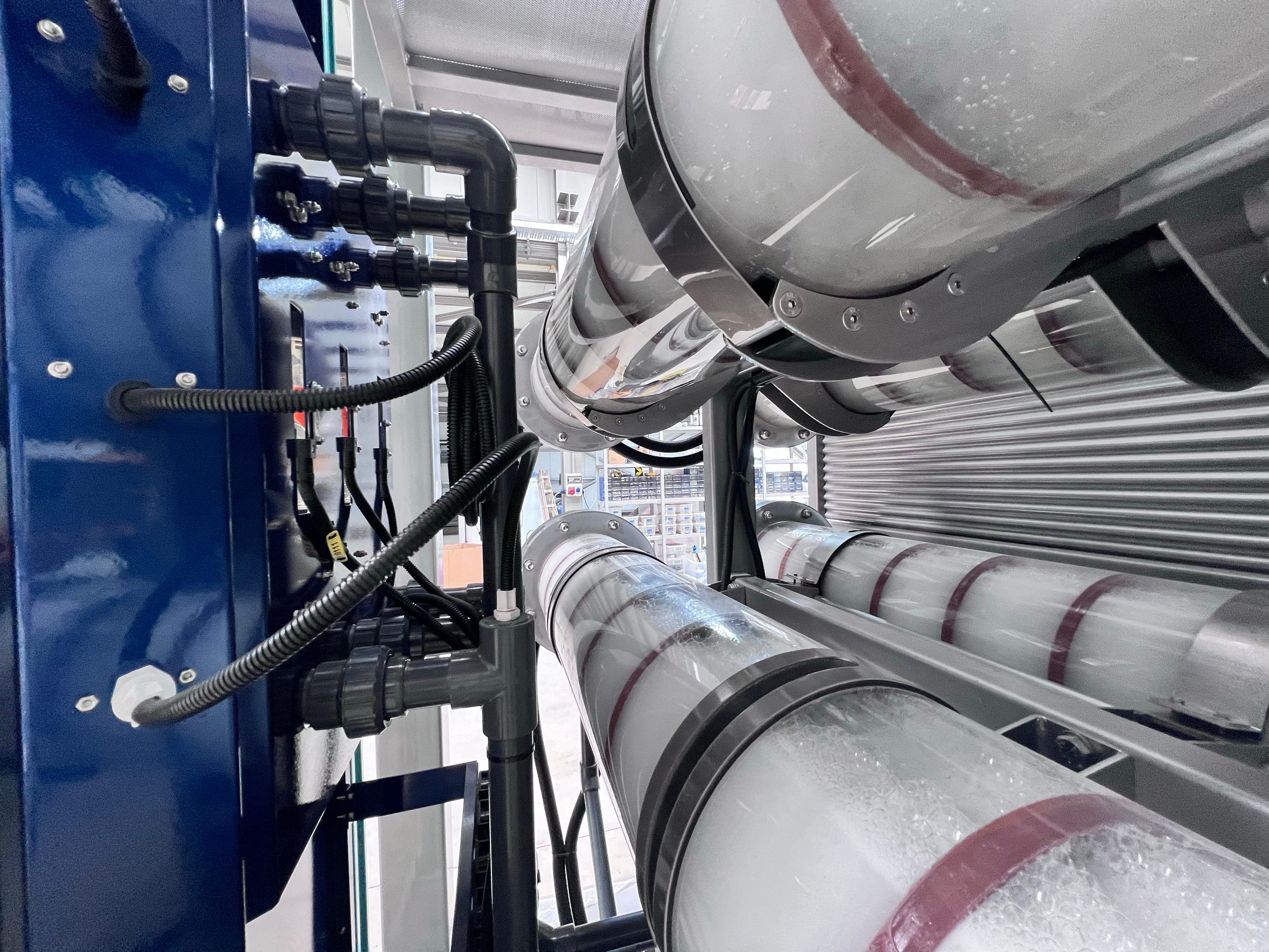 Close-up of Kemisan CX electrolyzer cells and piping inside the containerized system
