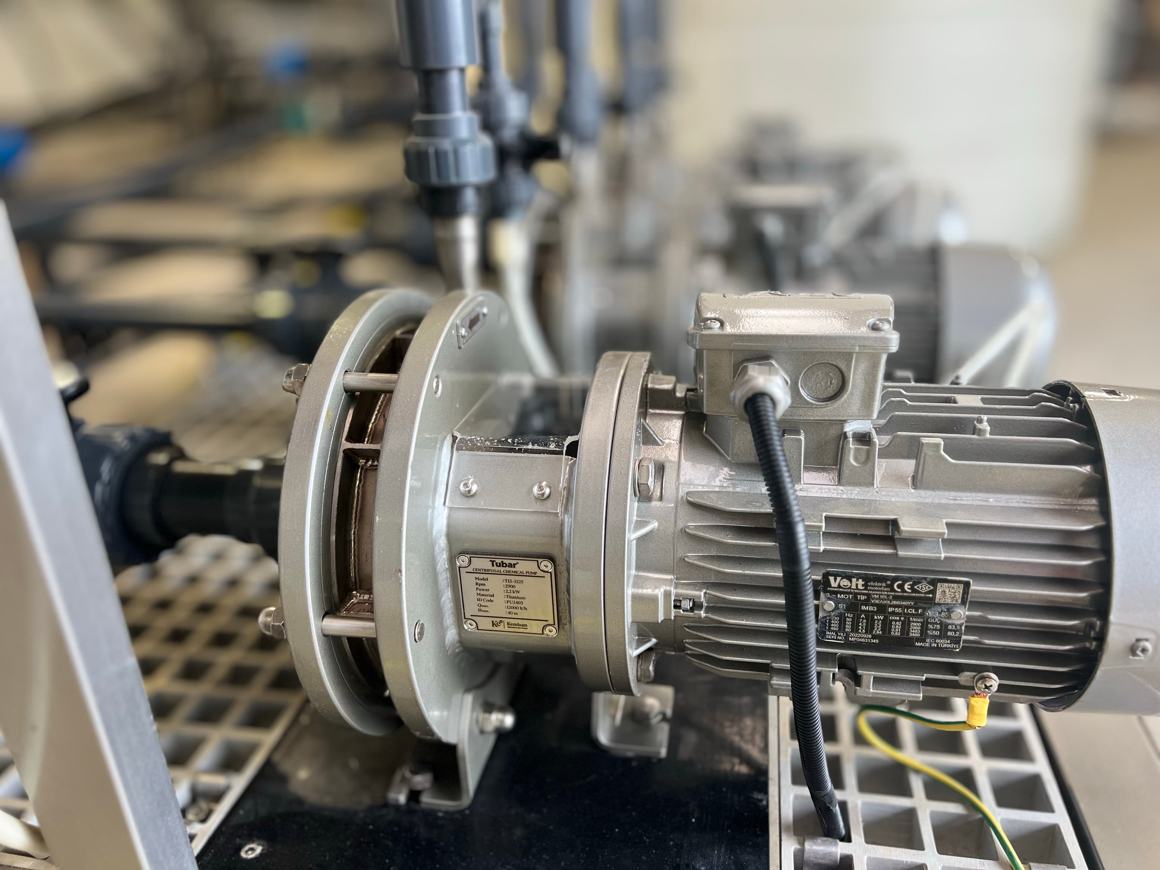 Close-up of a Kemisan Tubar titanium centrifugal pump installed on a HypoX CX dosing line