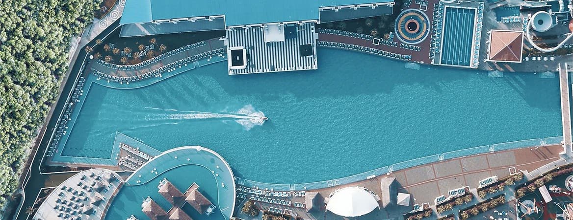 Aerial view of Granada Luxury Belek's swimming pool, one of the largest pools in Europe