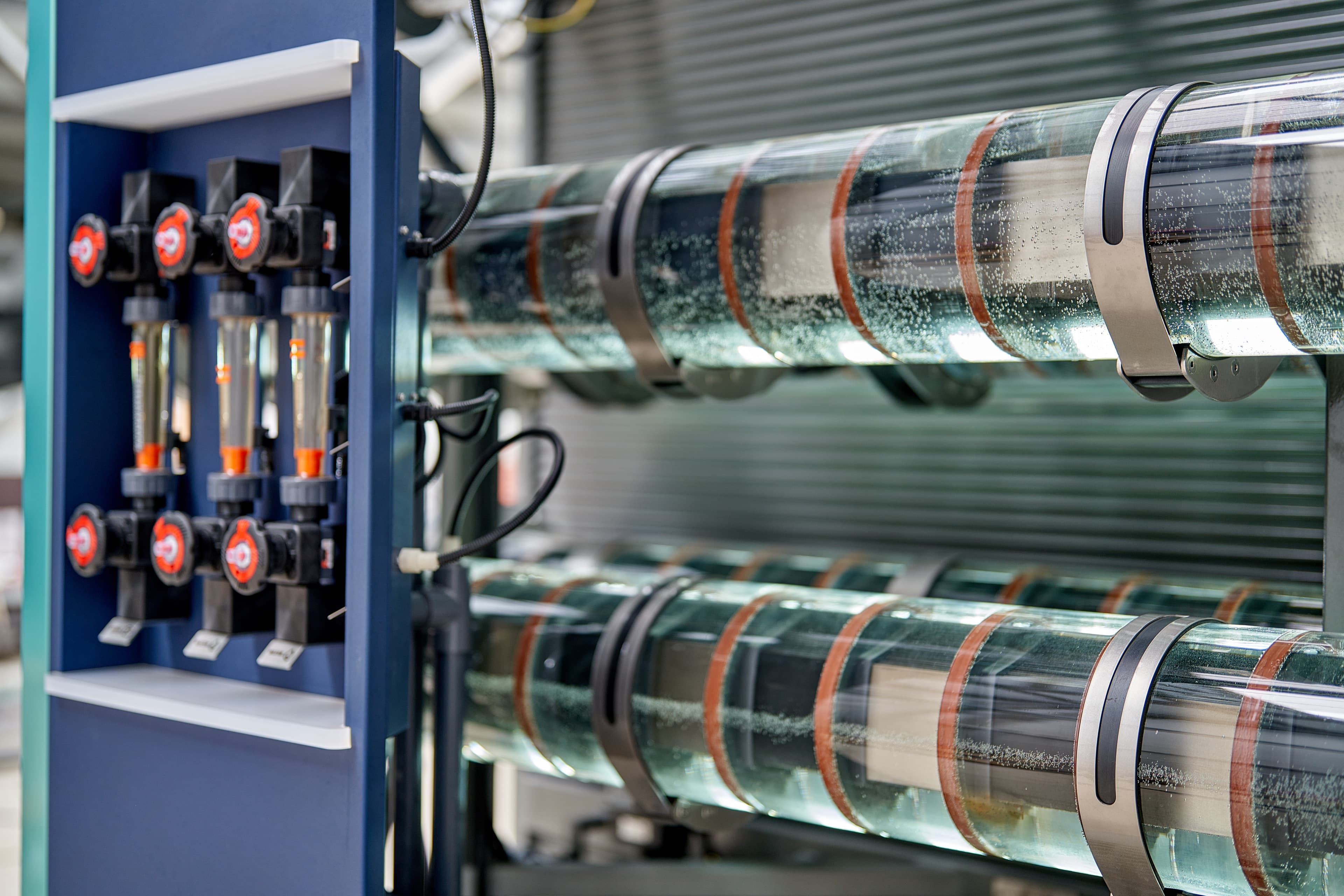 Close-up of the HypoX generator's electrolysis cells and flow meter panel