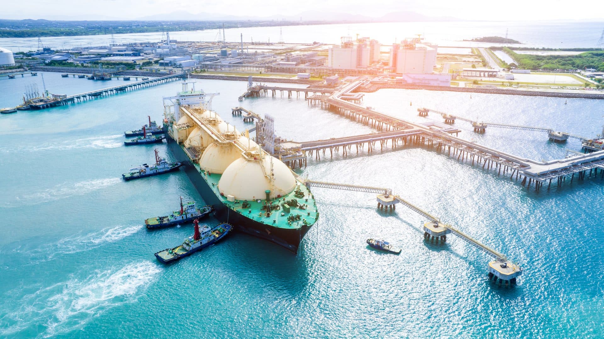 Aerial view of an LNG tanker moored at a marine gas terminal