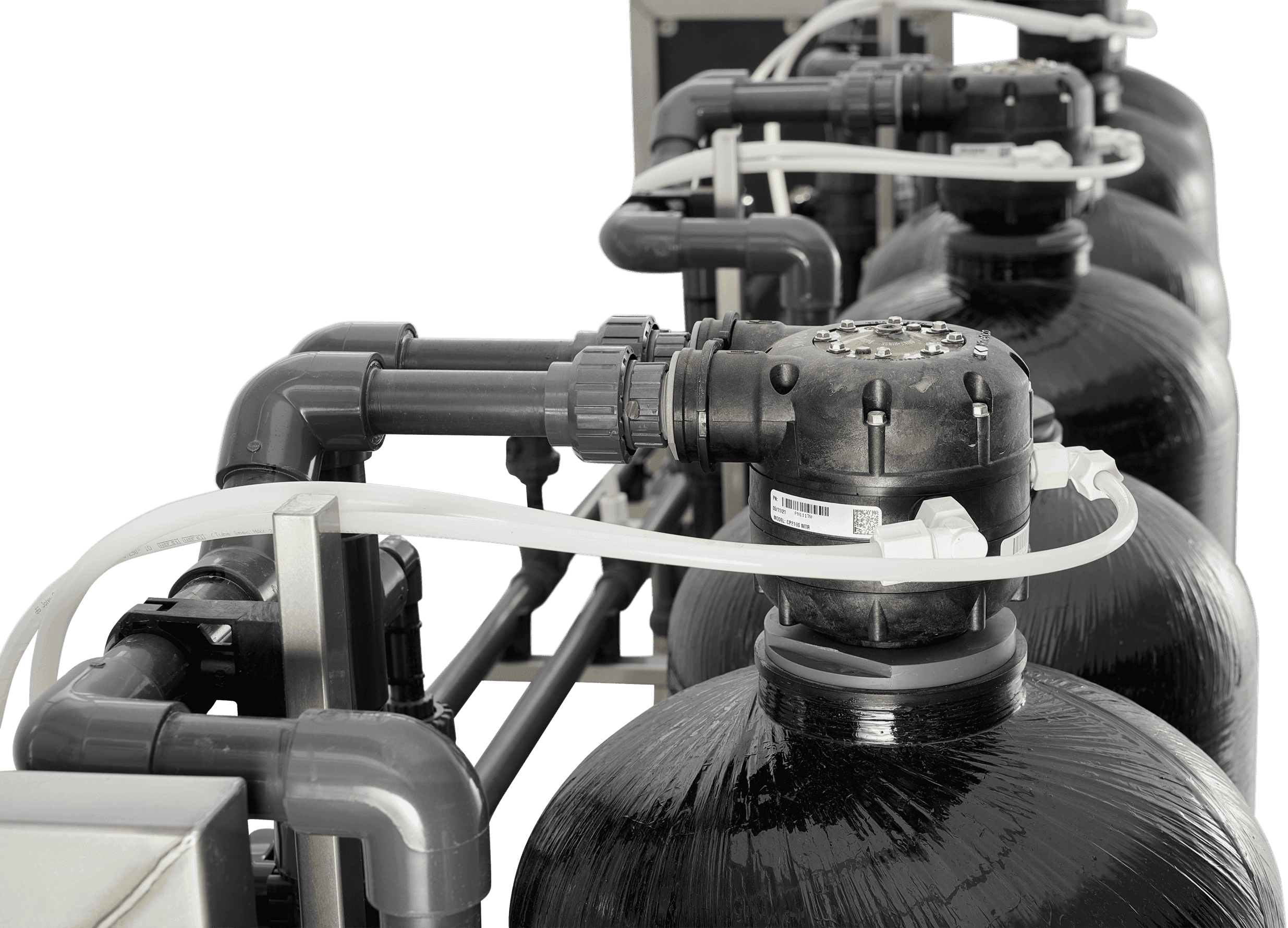 Twin resin tubes and a mechanical softener controller head on a HypoX LX skid, enabling continuous softening without electrical components